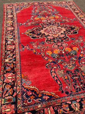 A very large rectangular red ground Persian floral rug ~ 12ft x 8ft