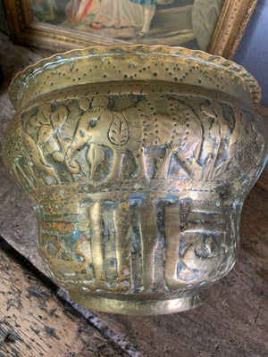 A large Middle Eastern repousse vessel