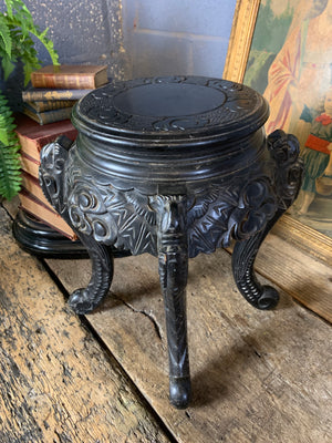 A small Chinese ebonised pedestal stand