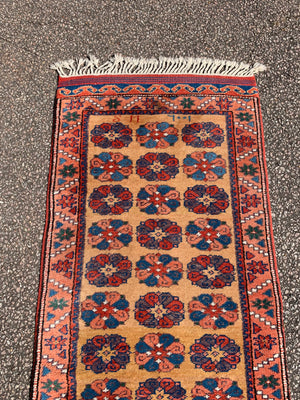 A long yellow ground red blue Persian runner rug ~ 257cm x 67cm