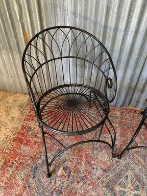 A black wirework garden table and chairs set