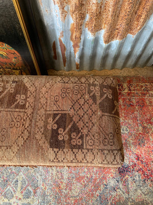 A large Persian carpet footstool