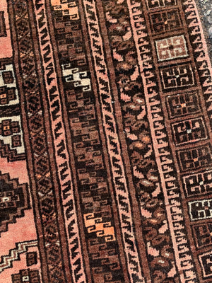 A Persian brown ground rectangular rug- 243cm x 166cm