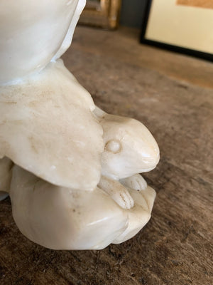 A Chinese stone sculpture depicting rabbits