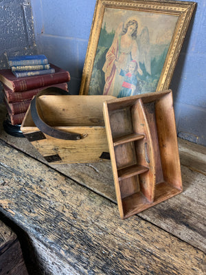 A wooden two tiered housemaid's trug