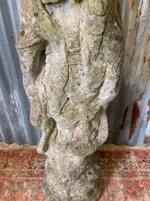 A cast stone garden statue of Guanyin