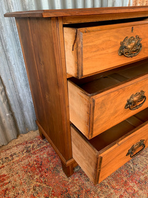 An Art Nouveau chest of drawers