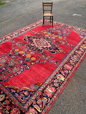 A very large rectangular red ground Persian floral rug ~ 12ft x 8ft