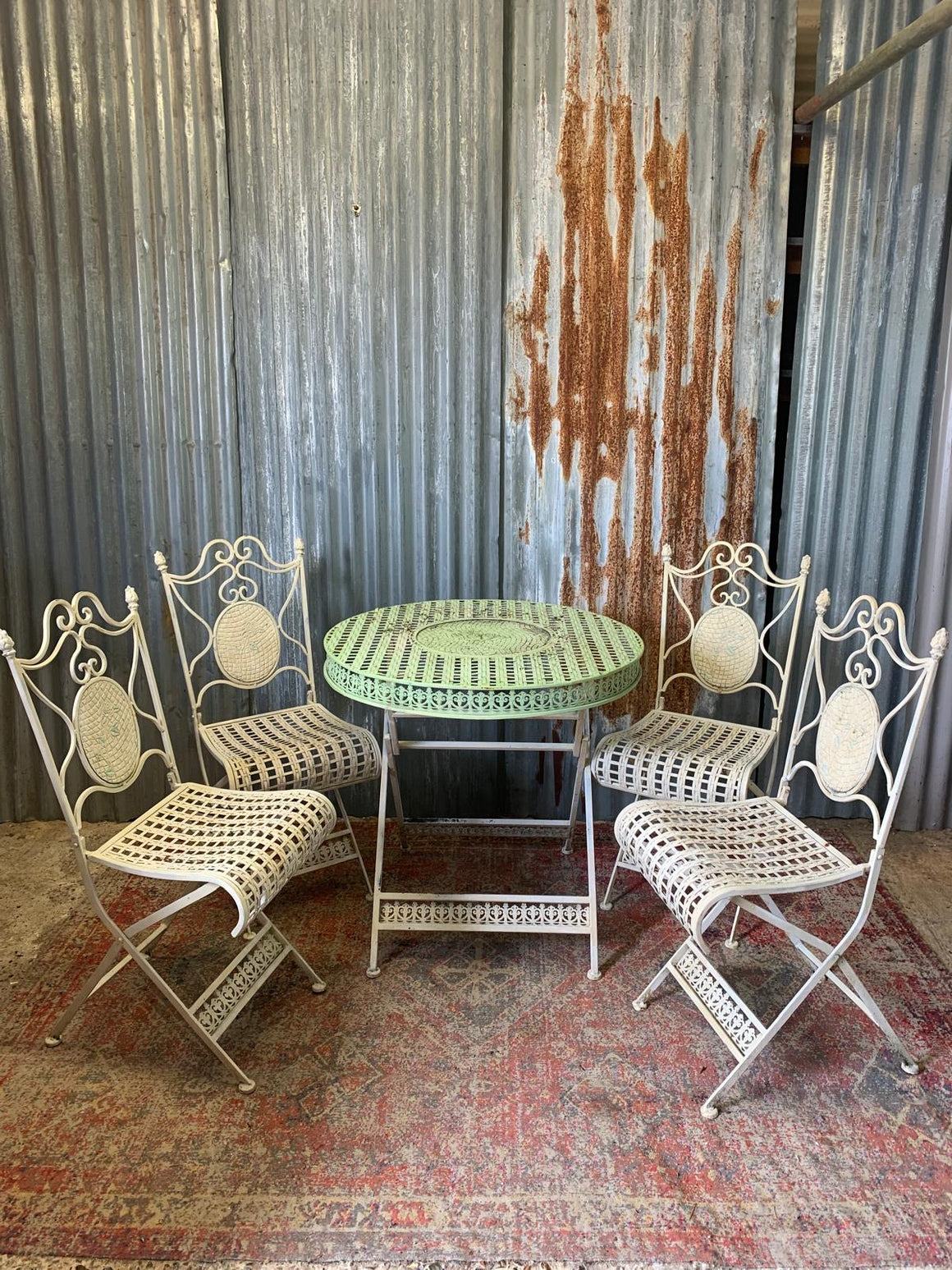 A lattice design garden table and chairs set