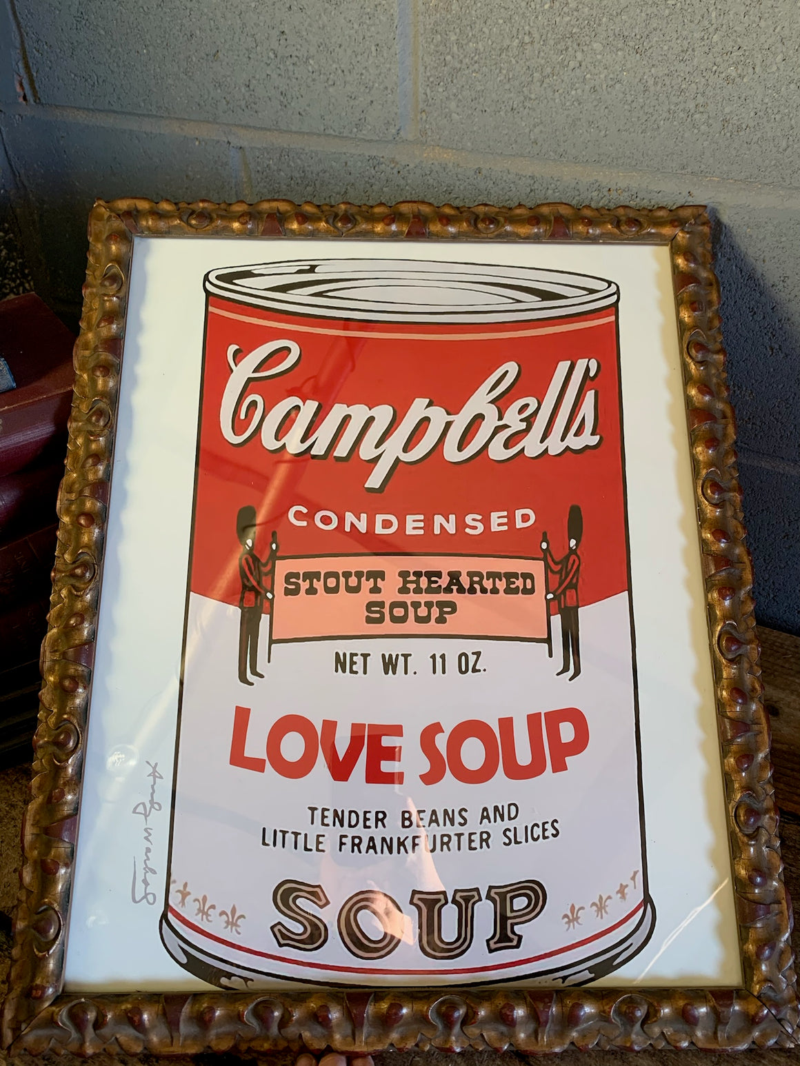 A framed and glazed Warhol print - "Campbell's soup can" - in an antique frame