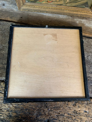 A square faux bamboo ebonised mirror