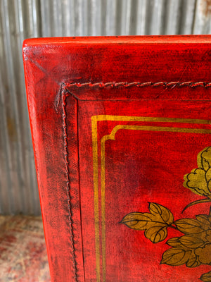 A red and gold lacquered chinoiserie cabinet