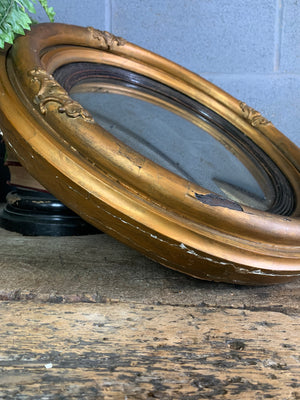 A large Regency giltwood convex mirror