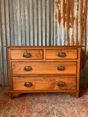 An Art Nouveau chest of drawers