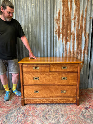 A satinwood chest of drawers