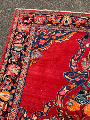 A very large rectangular red ground Persian floral rug ~ 12ft x 8ft