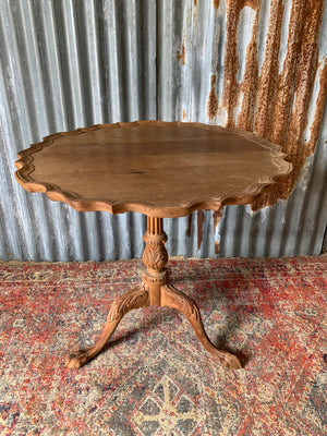 A Georgian style tilt top table with ball and claw feet