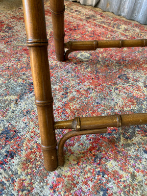 A faux bamboo butler's tray table