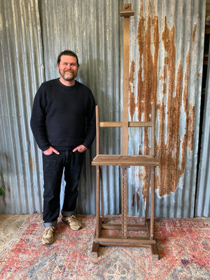 A floor standing and foldable wooden artist's easel