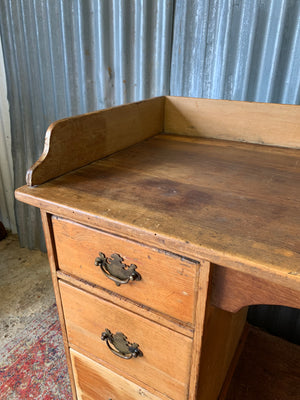 A pine clerk's desk with galleried top