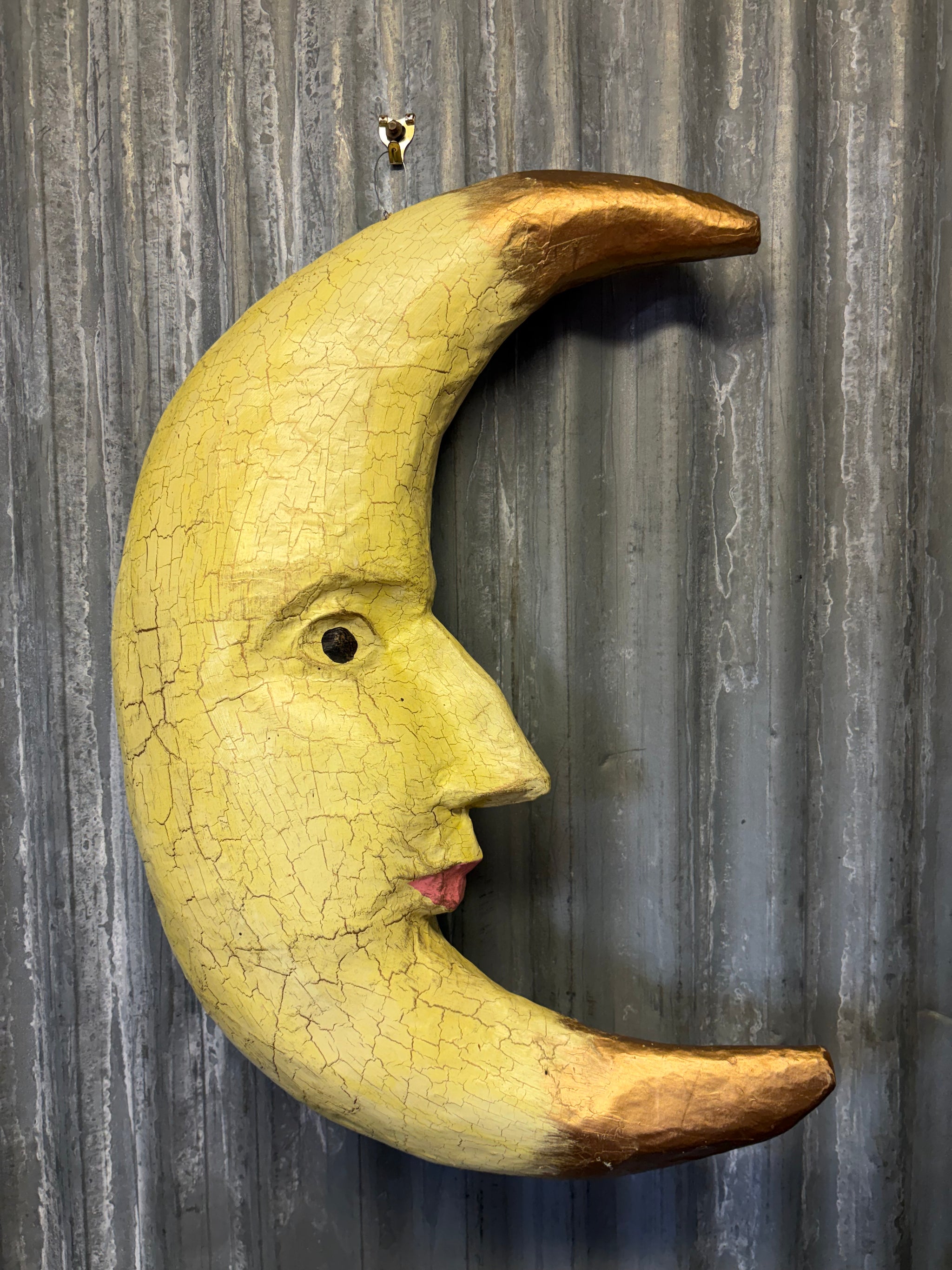 A papier-mache crescent moon model