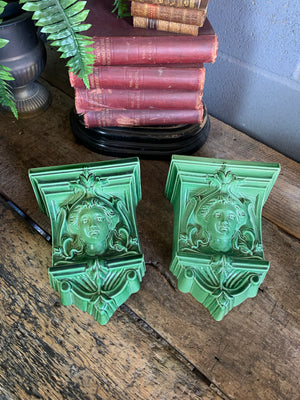 A pair of neoclassical ceramic wall pockets