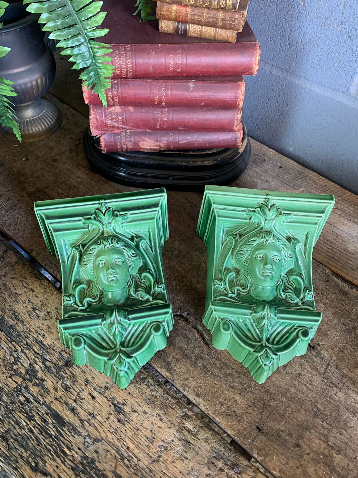 A pair of neoclassical ceramic wall pockets