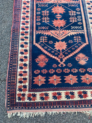 An Anatolian blue ground rug - 212cm x 114cm