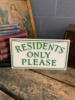 A hand-painted "Residents Only Please" sign
