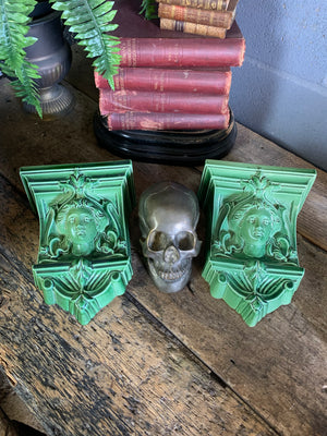 A pair of neoclassical ceramic wall pockets