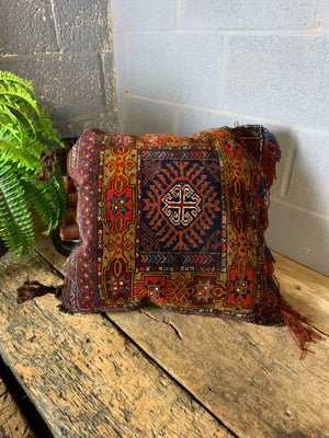 A Persian red ground square carpet cushion - 55cm x 55cm