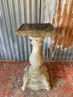 A large cast stone sundial