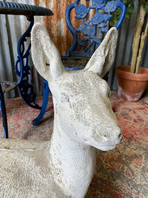 A large deer or fawn garden statue