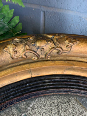 A large Regency giltwood convex mirror