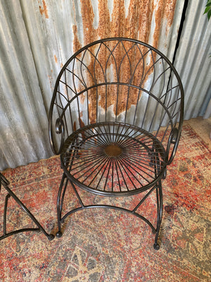 A black wirework garden table and chairs set