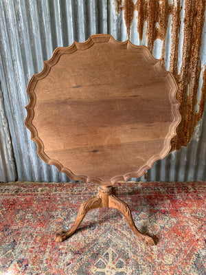 A Georgian style tilt top table with ball and claw feet