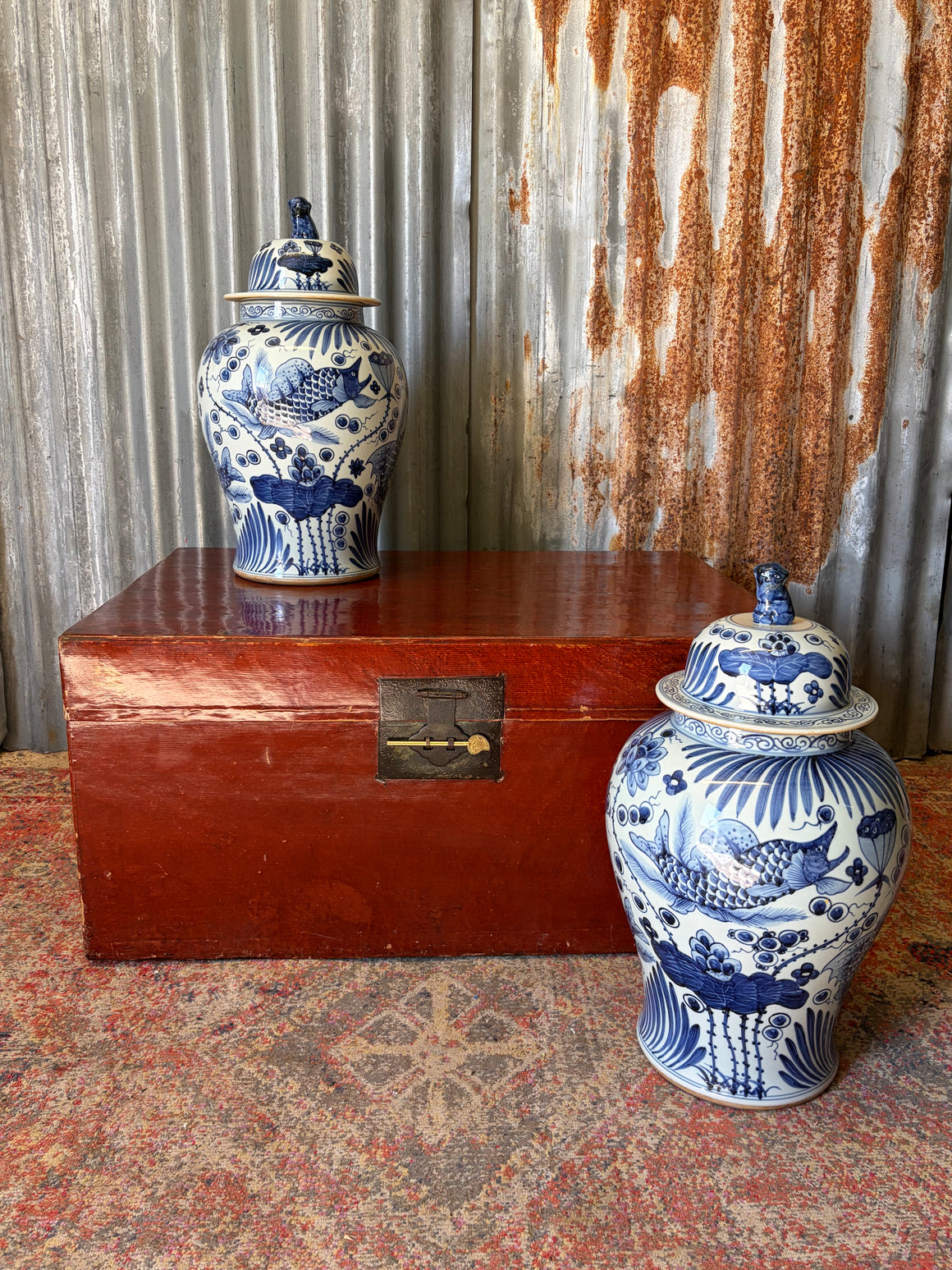 A pair of very large blue and white ginger jars with fish motifs
