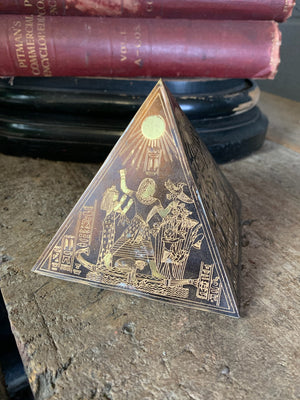 A group of four etched brass Egyptian revival pyramids