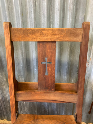 An Edwardian oak folding chapel chair by Mealing Bros