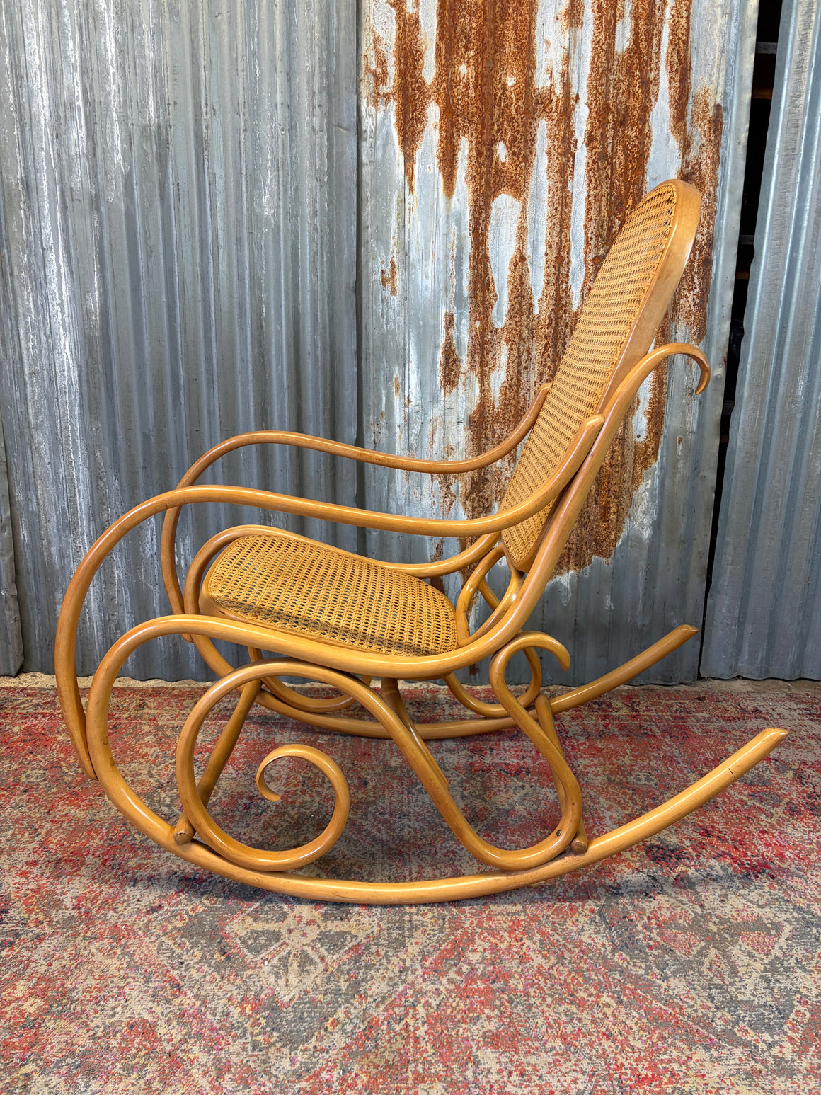 A bentwood and cane rocking chair by Dinette