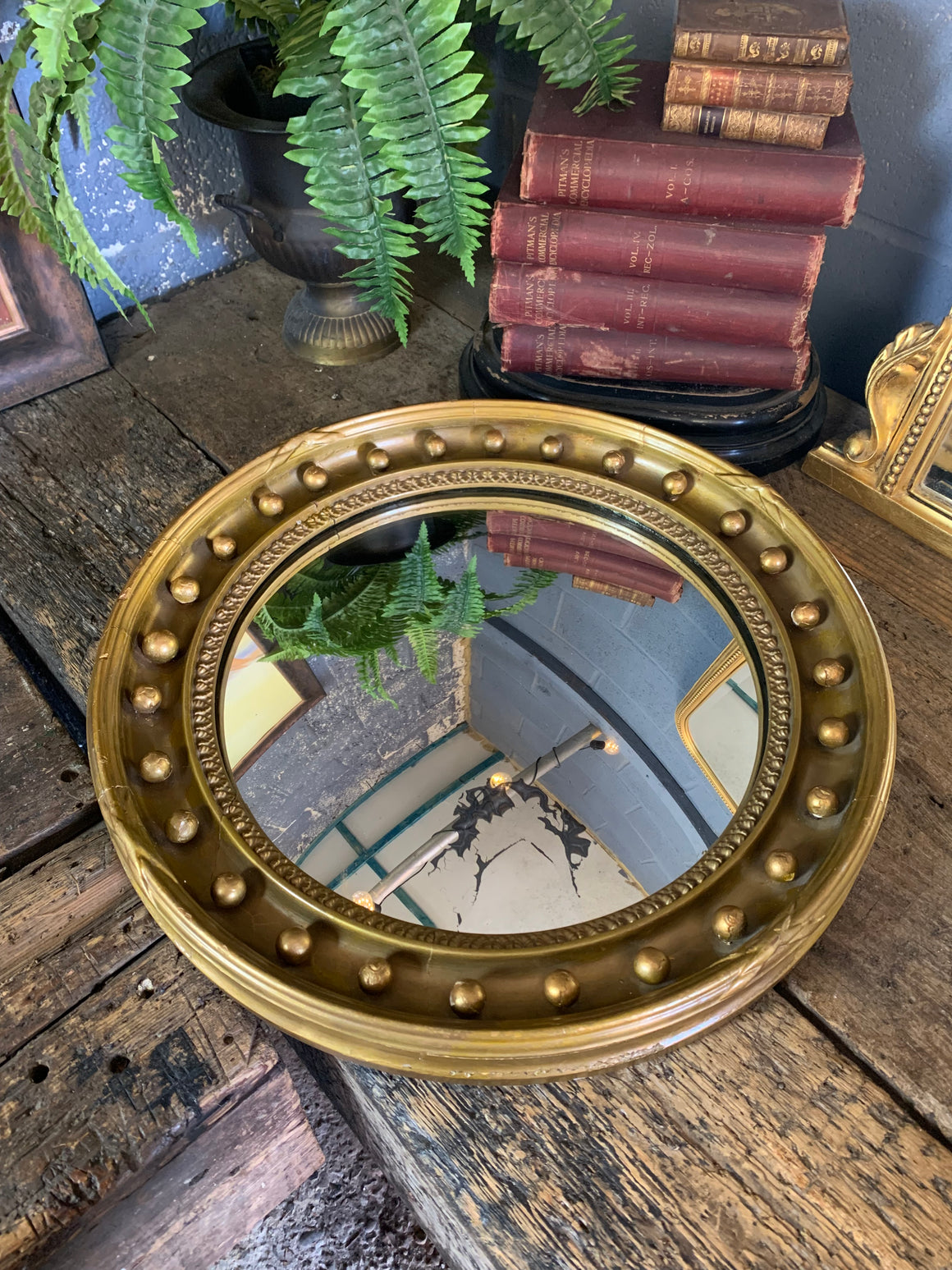 A large Regency style convex ball mirror