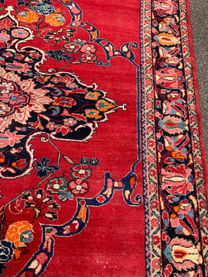 A very large rectangular red ground Persian floral rug ~ 12ft x 8ft