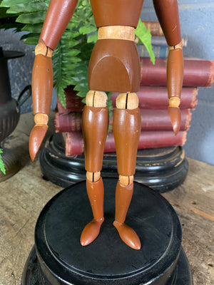 A two tone wooden artist's lay figure