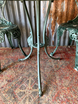 A green garden table and two chair bistro set