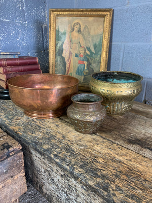 A large English beaten copper bowl