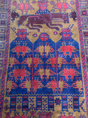 A Persian or Kurdish red ground pictorial rug - 165cm x 92cm