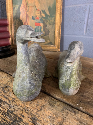 A pair of garden duck figures