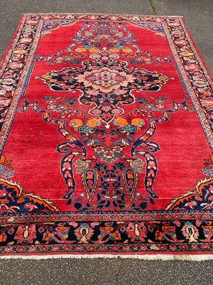 A very large rectangular red ground Persian floral rug ~ 12ft x 8ft