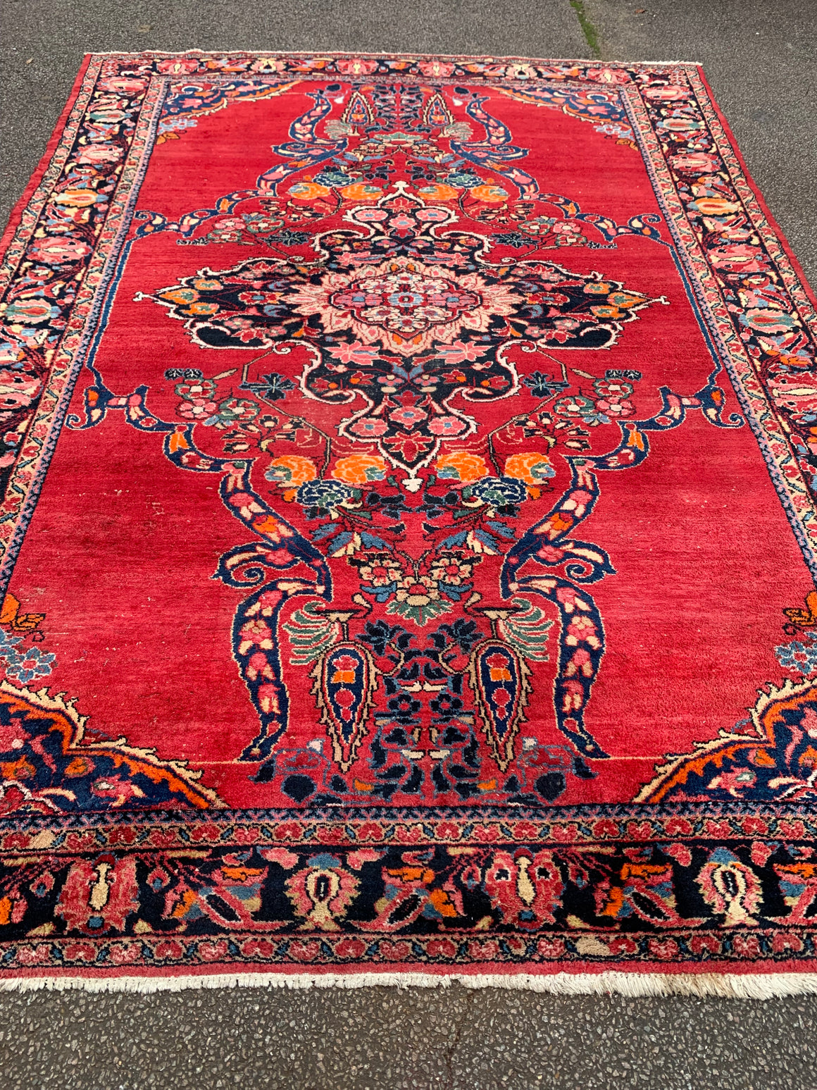 A very large rectangular red ground Persian floral rug ~ 12ft x 8ft