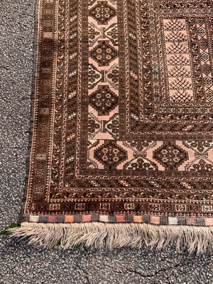 A Persian brown ground rectangular rug- 243cm x 166cm